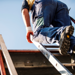 Construction roofer on ladder.