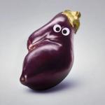 An eggplant with googly eyes.