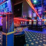 Interior of an elite Russian casino in Las Vegas with gaming machines and poker tables.