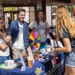 Students help staff the voter registration table in the student center of The College of New Jersey.