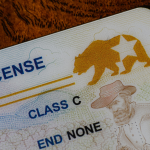 A closeup of the corner of a California Real ID driver license focusing on the REAL ID logo.