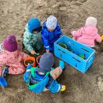 Children playing outside at a child care program run by the Norwegian nonprofit Kanvas.