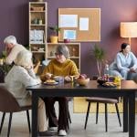 A group of seniors engaging in recreational activities in an assisted living facility.