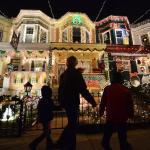 People enjoying the Christmas lights on the 700 block of 34th Street in the Hampden community of Baltimore, Maryland.