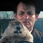 Bill Murray holding a groundhog in a scene from 'Groundhog Day'