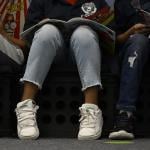Low angle photo of third-graders reading books in at Castro Elementary.