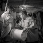 Tom Hill and neighbor Angel Putvain pour fresh milk into a collection vat during the Friday evening milking session.