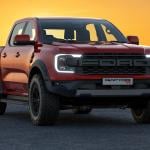 A red 2023 Ford Ranger Raptor with the sun setting in the background.
