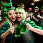 Two girls in a wig and a cap celebrating St. Patrick's Day in a bar.