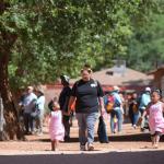 Winona Hastings and her daughters walk through the village of Supai on their way to the Havasupai Head Start and Early Start Program. 