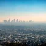 A foggy view of the downtown skyscraper buildings and suburbs of Los Angeles from Griffith Park in California.