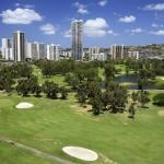 A golf course with condominium buildings overlooking in Hawaii.