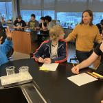 Tech Valley High School English teacher Catherine Eisele (center) leads an impromptu discussion with students during a class.
