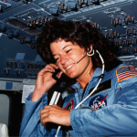Astronaut Sally K. Ride, STS-7 mission specialist, communicates with ground controllers from the flight deck of the Earth-orbiting Space Shuttle Challenger, circa 1983. 