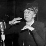 Eleanor Roosevelt in front of a microphone at a hearing in Washington DC, 1942. 