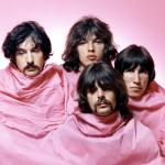 Pink Floyd pose for a portrait in Los Angeles in August 1968. (L–R) Nick Mason, Dave Gilmour, Rick Wright (center front), and Roger Waters.
