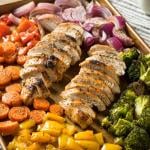 Close-up of homemade keto sheet pan chicken with rainbow vegetables.