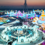 Tourists visit the 25th Harbin Ice and Snow World, one of the world's leading theme parks featuring large-scale ice and snow sculptures, on December 22, 2023 in Harbin, Heilongjiang Province of China.