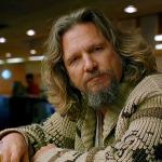 Jeff Bridges as The Big Lebowski sitting in the bowling alley