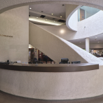 An interior view of a spiral staircase inside Carson City Hall in California.