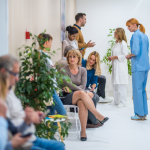 A medical waiting room filled with patients.