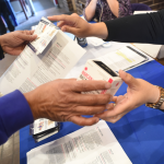 A community health nurse gives away free Narcan at a state health center.