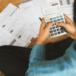 A man calculating his mortgage