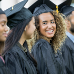 Female college graduates in line to receive their diplomas