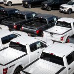 A parking lot of F-150 pickup trucks at a Ford dealership in Bellevue, Washington.
