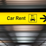 A sign pointing to where customers can rent a car