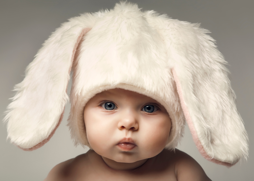 A baby in a furry bunny hat.