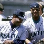 Ken Griffey Jr.  and Ken Griffey Sr. of the Seattle Mariners laugh together circa 1993.