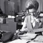1960s Female office worker working at desk