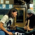 Rory Cochrane holding a bong, talking to another student, in a scene from Dazed and Confused.