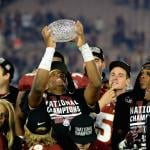 Jameis Winston of the Florida State Seminoles holds the trophy after defeating Auburn in the 2014 National Championship Game.