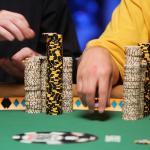 Players stack their chips as they compete in the World Series of Poker.
