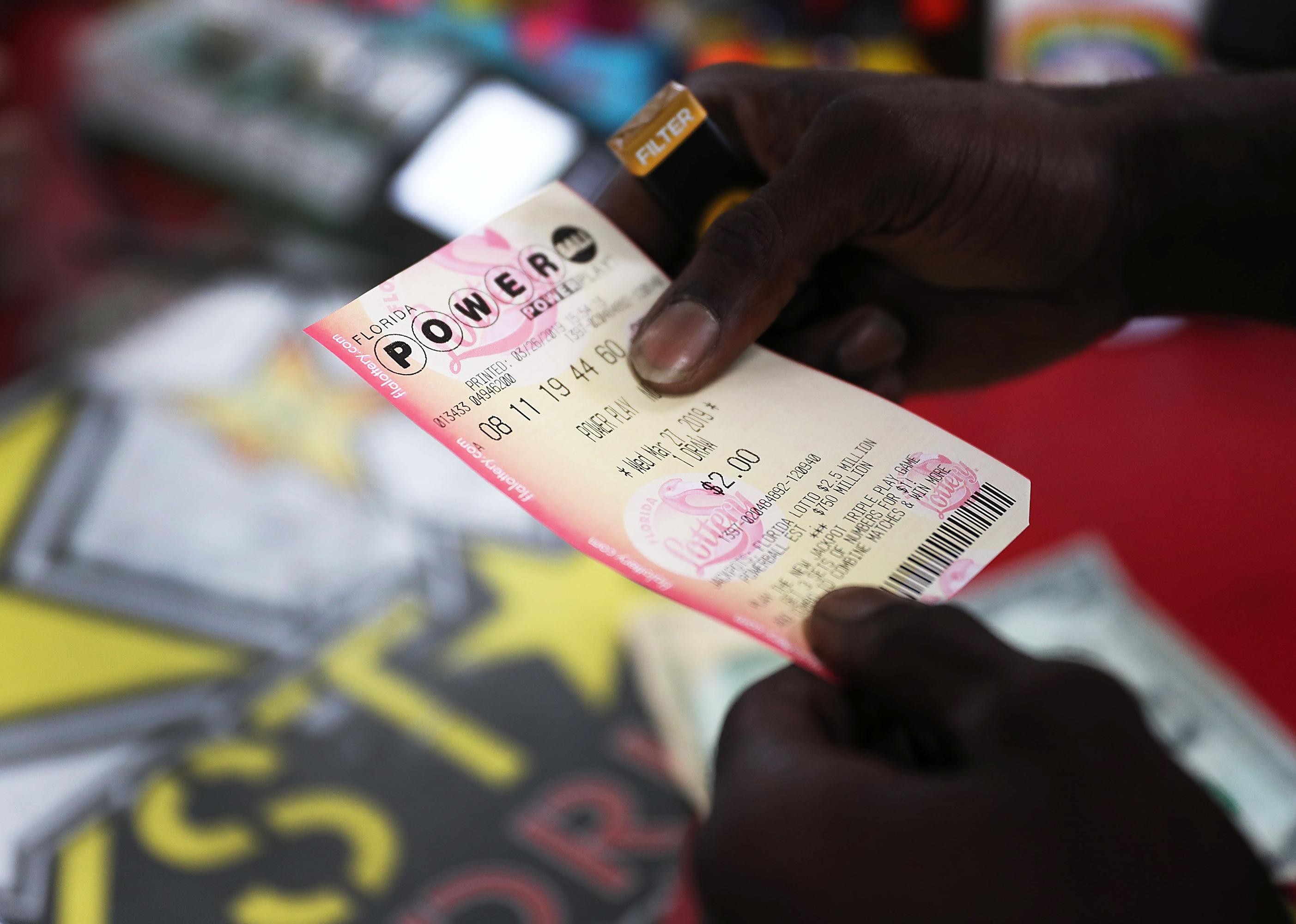 A man buying a powerball lottery ticket.