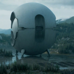 A large round object resembling some sort of space ship sits.