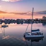 Catamaran on glassy water of intercoastal waterway in Wrightsville Beach.