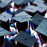 Large group of graduation caps during commencement.