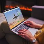 A woman booking plane tickets using computer.