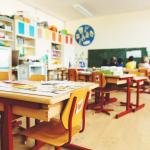 A desk in an empty elementary school classroom