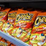 Several bags of Flamin' Hot Cheetos at the grocery store.