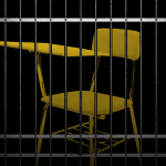 A school chair behind bars.