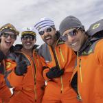 enis (Cory Michael Smith), Randall (Steve Carell), Jeff (Ramy Youssef) and Souper (Jason Schwartzman), from left, dressed in orange jackets in the show Mountainhead.