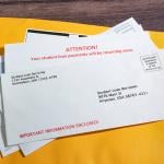 Pile of student loan notices sent by mail.
