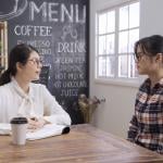 Cafe business owner interviewing a candidate for the business marketing staff.