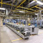 A large printing business for newspapers and magazines and their paper rolls and offset printing machines.