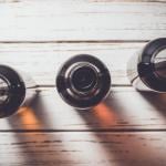Beer bottles on an old wooden table.