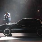 Kendrick Lamar on top of a car during his Super Bowl LIX Halftime Show.